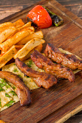 Grilled lamb fillet or Lamb Kusleme served with fries, lavash bread and bulgur pilaf