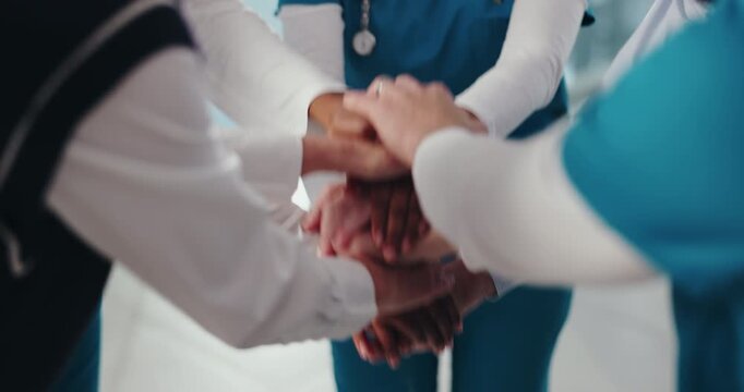 Hands stack, doctors and group at hospital in circle with motivation for healthcare services in corridor. People, nurse and surgeon in team huddle with celebration, collaboration and goals at clinic