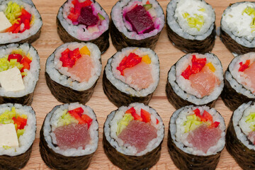 sushi on a wooden plate