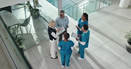 Business, people and doctors in meeting with paperwork for surgery funding, feedback or action plan. Above, hospital staff or medical team with discussion for clinic management or healthcare support - Powered by Adobe