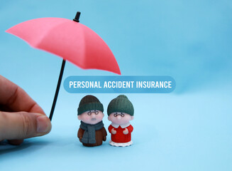 Personal Accident Insurance concept with couple figure and red umbrella