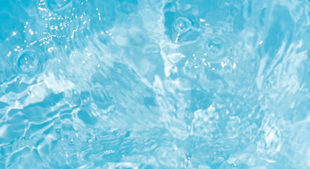 Blue water with ripples on the surface. Defocus blurred transparent blue colored clear calm water...