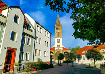 Historic St. Nicholas Church (St.-Nicolai-Kirche) and buildings on Boetzower Platz in Oranienburg,...