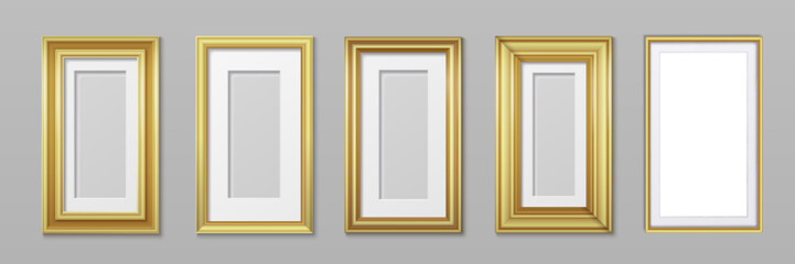 Fototapeta na wymiar Gold photo frames collection on gray wall - elegant golden rectangular borders for artwork display. Classic gallery presentation in various sizes with luxurious metallic finish for interior decoration