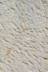 Natural vertical stone texture, rough rock surface detail