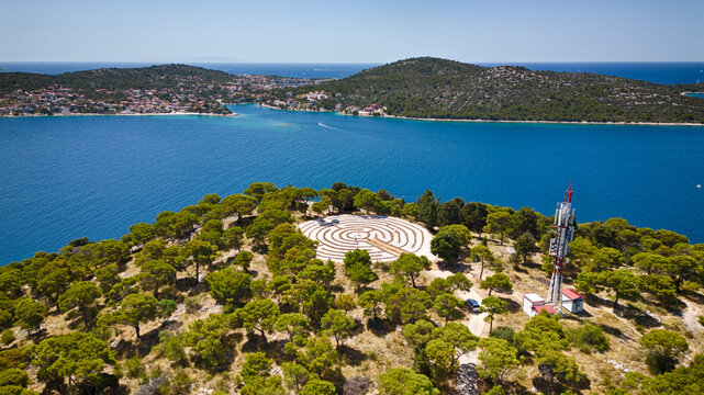 Aerial view of the  Gradina Peninsula, a labyrinth design etched on the surface, contrasting with the azure sea, Rogoznica, &Aring;&nbsp;ibensko-kninska &Aring;&frac34;upanija, Croatia.