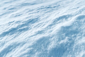 Fresh snow surface showing subtle blue shadows in winter