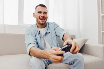 A man enjoying a digital detox while playing video games, reflecting on his work-life blur and...
