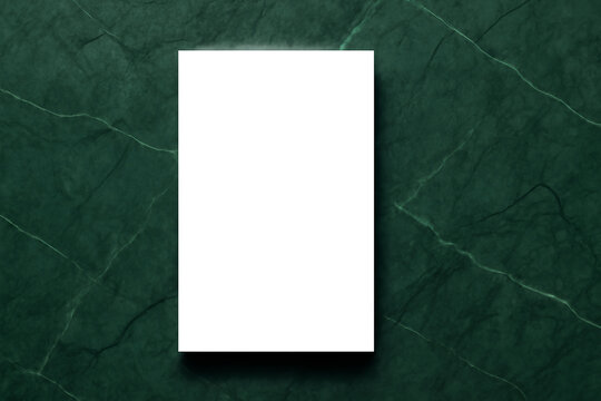 Elegant blank white paper on dark green marble background for invitations, announcements, and artistic presentations, perfect for designers