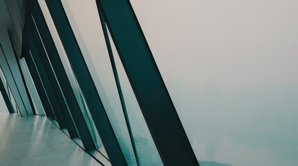 A modern office building facade featuring diagonal glass panels that refract sunlight into dynamic patterns, framed by sleek black aluminum structures.