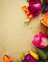 A vibrant arrangement of colorful roses and flowers on a textured background.
