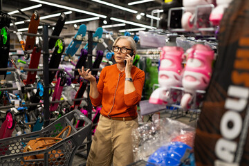 Woman engaged in shopping and decision-making while surrounded by various items in a bustling...