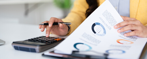 Business financing accounting banking concept. Businesswoman hand doing finances and calculate on...