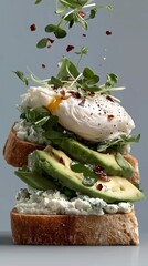 Minimalistic food art of gourmet toast with poached egg and greens, isolated against blue-gray background. Elevated modern breakfast aesthetic