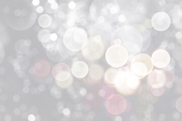 Blurred shiny silver background with sparkling glitter, bokeh effect