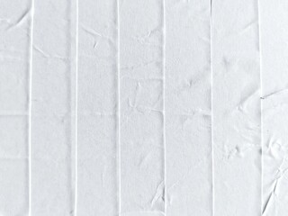 White crumpled with wavy surface glued and creased glued wrinkled paper poster texture background....