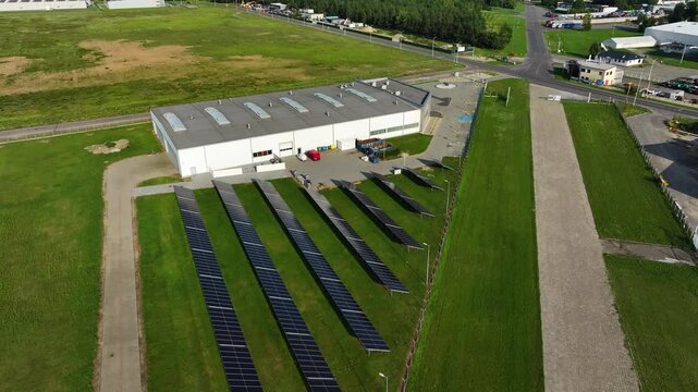 Generating renewable energy with solar panels in a green landscape setting