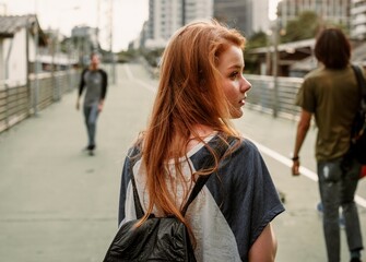 Girl hanging out with skaters on weekend