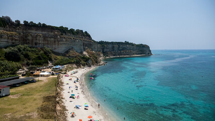 Obraz premium Beach Scene with Cliffs and Turquoise Waters – Aerial View of Santa Domenica, Calabria