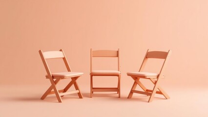 Fototapeta premium Three chairs standing on a peach colored background in a studio setting with soft lighting