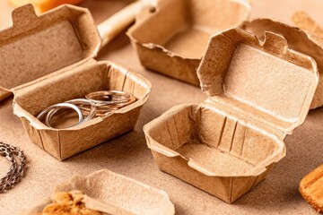 Recycled cardboard containers holding jewelry