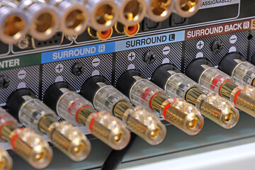 Rear panel of a high-quality AV receiver with multimedia connections for connecting speakers,...