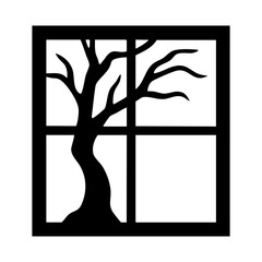 Spooky tree silhouette seen through window