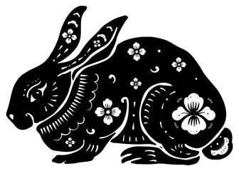 Black and white illustration of a rabbit with floral patterns. The rabbit design features intricate flowers, creating a decorative rabbit motif. Chinese zodiac rabbit illustration isolated on white.