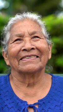 A Beautiful Senior Indigenous Woman Laughing and Smiling Outdoors, Expressing Joy and Contentment in Her Golden Years, Perfect for Healthcare or Community Content