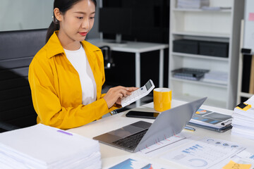Business women are calculating daily expenses.