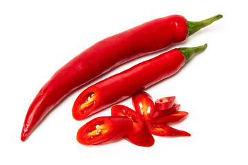 Sliced pods of red natural organic chili pepper on white background
