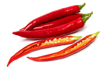 Sliced pods of red natural organic chili pepper on white background