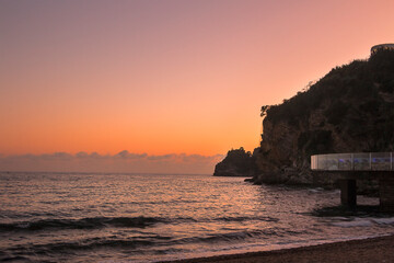 Pink sunset over the sea. Evening landscape