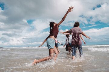 Asian family enjoying beach travel together, generations. retirement wellness, love, and joyful...