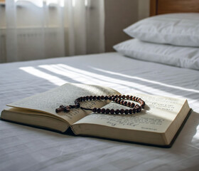 Open handwritten pilgrim journal with wooden rosary and cross on bed, symbolizing reflection, faith, and rest during Camino de Santiago journey.