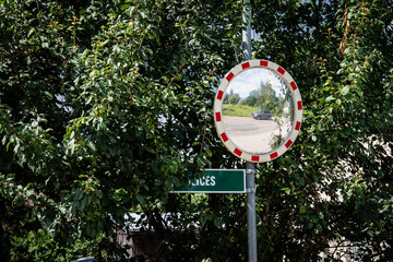 Traffic Mirror Reflection with Car and Trees – Safety, Visibility, and Awareness in Urban Environment
