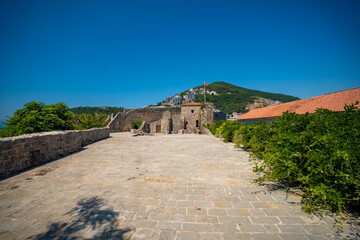 Citadel fortress and panoramic terrace in Budva, Montenegro. View of historic architecture and coastal heritage site.