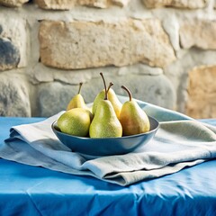 Five golden-green pears with natural blemishes in terracotta bowl on blue cloth, set before rustic stone wall evoking autumn realism and charm
