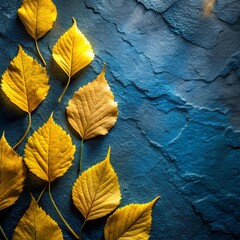 Eight golden-yellow leaves arranged in scattered formation on textured blue backdrop, highlighting natural contrast and seasonal simplicity