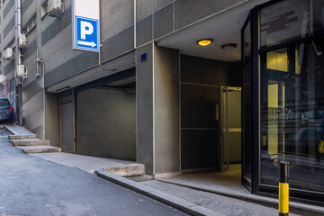 Underground garage entrance with parking sign