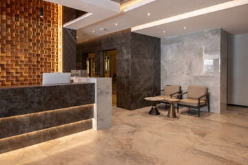 Modern hotel reception with wooden wall