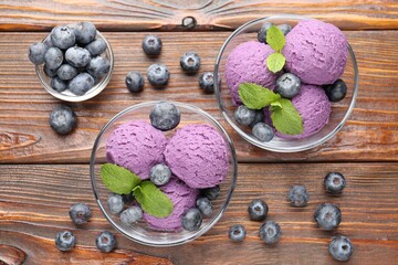 Tasty sorbet with blueberries and mint served on wooden table, flat lay