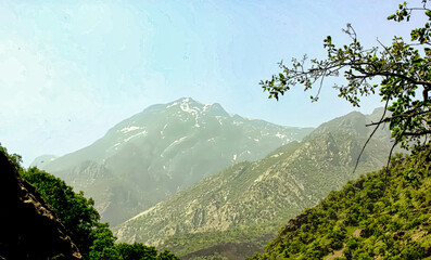 A mountain range with a clear blue sky in the background