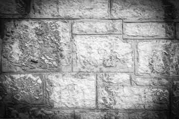 Black and White Stone Wall Texture with Intricate Details. Vignette Effect.