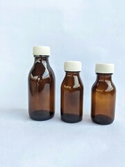 Three bottles of syrup medicine