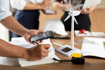 Sustainability Documentation. Professional calculating eco-friendly project metrics.
