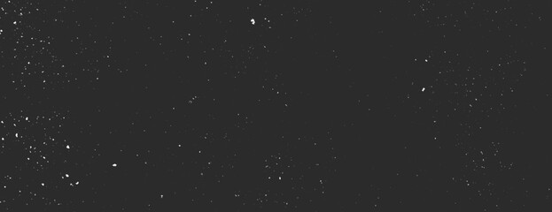 Dark black background with a starry texture. The black background features scattered white specks resembling stars in the night sky. Speckled wall texture background. Black background vector.