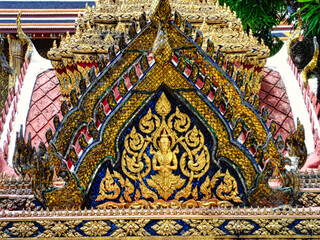 A gold and blue archway with a person in the middle