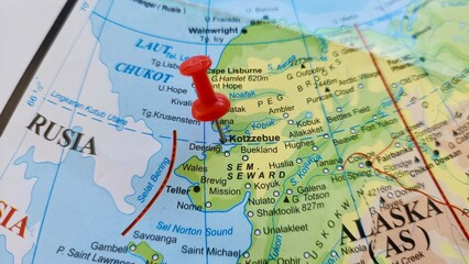 View of Kotzebue, City in Alaska, USA, on a geographical map of America, marked with red push pin