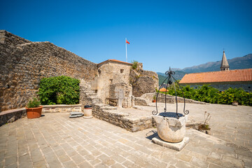 Citadel fortress and panoramic terrace in Budva, Montenegro. View of historic architecture and coastal heritage site.